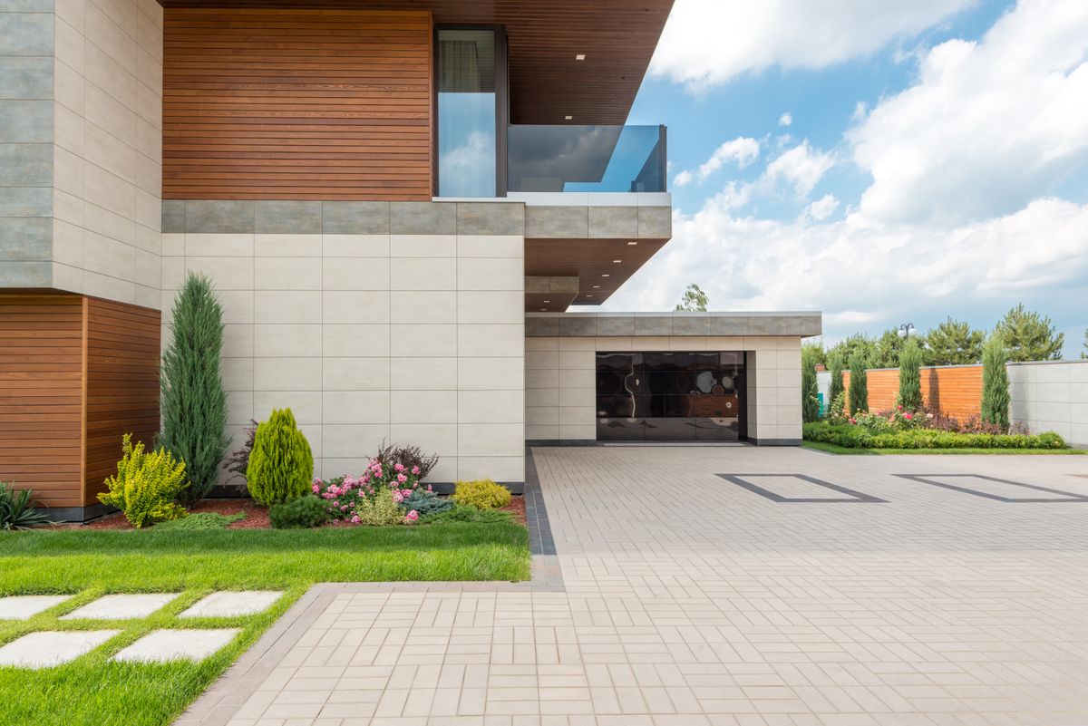 Clean concrete driveway leading to a garage