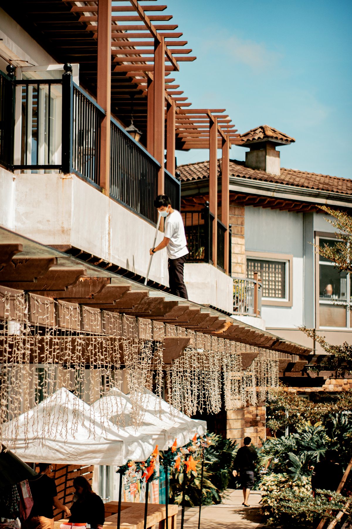 Cleaner working on a residential roof