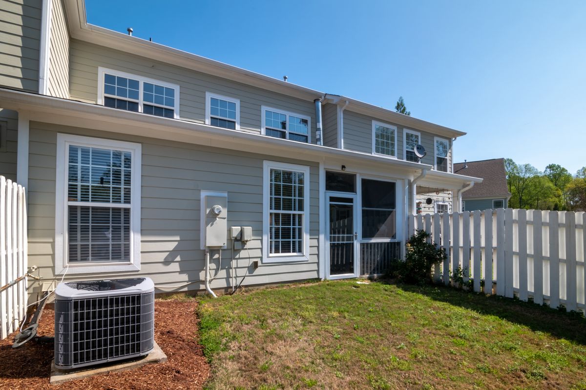 Clean modern house exterior with light gray siding